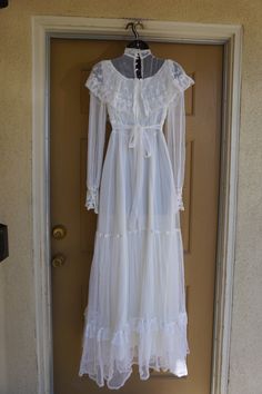 "Beautiful Gunne Sax white layered dress. In good condition but is missing two buttons from at back of neck - see last photo. Labeled as a size 7 but fits like modern size 5. Measurements taken across front laid flat 17\" across front armpit to armpit 13\" across front of waist 58\" length" Long Sleeve Maxi Dress With Lace Trim For Wedding, White Lace Prairie Dress For Wedding, White Lace Prairie Wedding Dress, Vintage White Prairie Dress With Lace Trim For Wedding, White Victorian Prairie Dress For Wedding, Vintage Long Sleeve Maxi Dress For Wedding, White Prairie Dress With Lace Trim For Wedding, Vintage Maxi Prairie Dress For Wedding, Vintage Lace Maxi Dress For Wedding