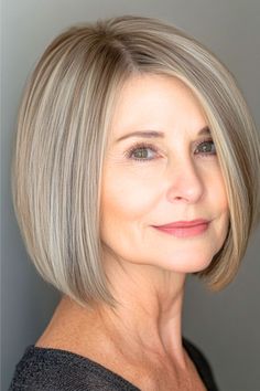 Straight Bob Hairstyle on a woman in her 50s with straight short light brown hair.