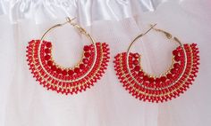 Large Boho earrings in a summer look, the fresh color combination of red and gold immediately creates a festive atmosphere and an elegant look. Large boho earrings that call for a festival or a little gift for a loved one. It is also an elegant addition to your outfit for an evening walk on the beach. Vielen Dank für Ihren Besuch in meinem Shop, und wenn Sie Fragen haben, zögern Sie nicht, mich zu kontaktieren. Handmade Red Hoop Earrings For Party, Handmade Red Hoop Earrings For Beach, Red Bohemian Hoop Earrings For Summer, Red Bohemian Hoop Earrings For Beach, Bohemian Red Hoop Earrings For Beach, Elegant Red Beaded Hoop Earrings, Elegant Red Hoop Earrings, Red Round Beaded Party Earrings, Red Round Earrings For Beach