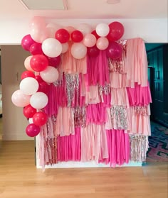 DIY Pink photo backdrop with frine and half balloon garland, made with multi purpose net and plastic table cloths Table Cloth Party Backdrop, Hot Pink Backdrop Ideas, 21 Birthday Photo Backdrop, Diy Bachelorette Photo Backdrop, Diy Pink Photo Backdrop, Table Cloth Garland Backdrop, 21st Bday Balloon Ideas, Cute Photo Backdrops Diy, Photo Backdrop With Balloon Garland