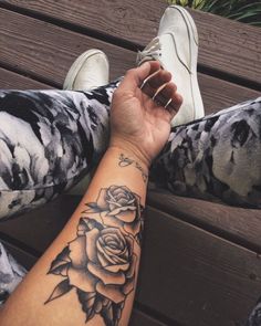 a person's arm with a rose tattoo on it and the caption is instagram