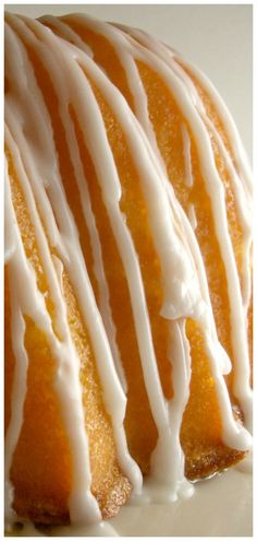 an orange cake with white icing on top