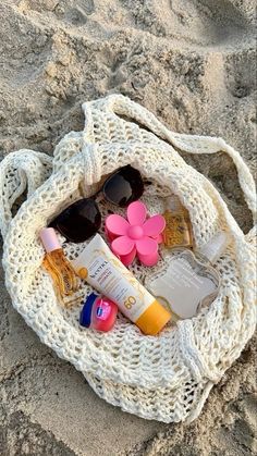 the beach bag is filled with various items