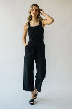 Embrace effortless style with The Tompkins Square Neck Jumpsuit in Black! This versatile jumpsuit features a chic square neckline and flattering silhouette, perfect for any occasion. Elevate your wardrobe with this must-have piece! Details Model is wearing a small self/lining: 60% cotton + 40% polyester Fabric Care Guide Here Sizing & Fit Measurements are approximate and taken while laying flat across the front. Not doubled. small: bust = 16"; waist = 13"; inseam = 26"; length= 54" medium: bust Spring Square Neck Jumpsuits And Rompers, Chic Summer Jumpsuits And Rompers With Square Neck, Chic Black Cotton Jumpsuits And Rompers, Square Neck Jumpsuit, Piper And Scoot, Crochet Sandals, Linen Midi Dress, Detailed Sweater, Jelly Sandals