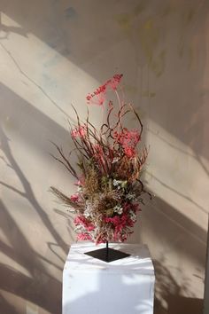 This is beautiful dried flower sculpture with black metal stand made by London based floral artist - Design by Nature Flower Sculpture