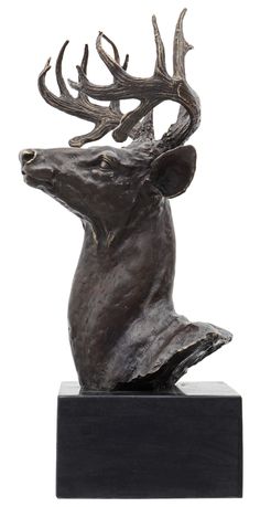 a bronze statue of a deer with antlers on it's head