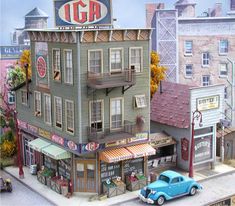 an image of a model town with cars and buildings