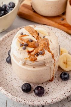 a dessert with bananas and blueberries on a plate