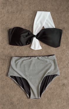 Luxurious two-tone striped bikini with a black bandeau top featuring a white knot, and coordinating high-waisted bottoms, from the Yacht Luxury Collection, presented on a textured background. Yacht Luxury, Beach Stuff, Black Bandeau, Men Beach, Luxury Collection, Luxury Yachts, Woman Beach, Shirt Accessories, Exclusive Collection