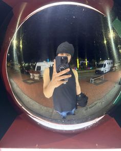 a man taking a selfie in front of a mirror