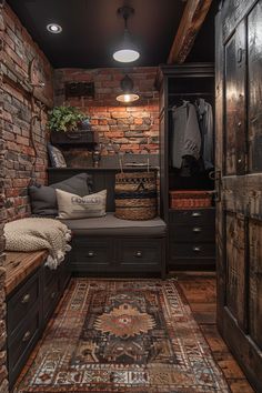 a room with a bench, rug and brick walls in it's closet area