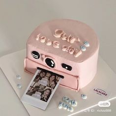 a cake that is shaped like an old fashioned camera with the word love on it