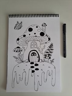 a drawing of a mushroom house on top of a table