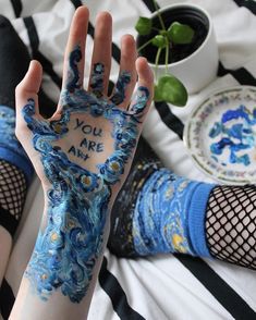 someone has their hand painted with the words you are