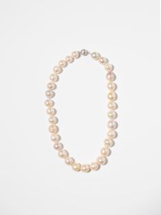 Add a touch of sophisticated, timeless beauty to your wardrobe with our Pink Pearl Necklace. Elevate any outfit with this elegant piece! 18 inches long Freshwater Pearls Elegant Long Necklace With 17 Jewels, Timeless Single Strand Necklace For Wedding, Formal Single Strand Round Necklace, Elegant Long White Gold Necklace, Timeless Single Strand Wedding Necklace, Elegant White Gold Long Necklace, Feminine Formal Necklace With Pearl Chain, Classic Single Strand Pearl Necklace For Formal Occasions, Feminine Formal Necklaces With Pearl Chain