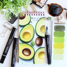 an avocado is shown next to some eyeglasses and other items on a table