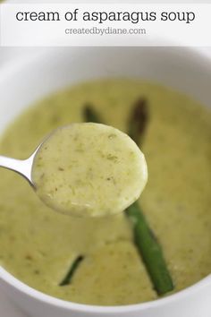 a spoon full of cream of asparagus soup