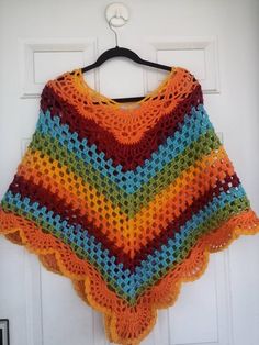 "This beautiful poncho is handmade from 100 percent acrylic yarn. It is a great addition to any woman wardrobe. The neck circumference is 35\"/89cm and lent from V down is 24\"/61cm long. The colors are beautiful and vibrant. Care: wash and dry on low temperature." Multicolor Poncho Shawl For Winter, Multicolor Shawl Poncho For Winter, One Size Multicolor Poncho For Fall, Multicolor One Size Poncho For Fall, Winter Multicolor Knitted Poncho, Bohemian Multicolor Poncho For Fall, Multicolor Shawl Poncho For Fall, Multicolor Bohemian Poncho For Fall, One Size Acrylic Poncho Shawl