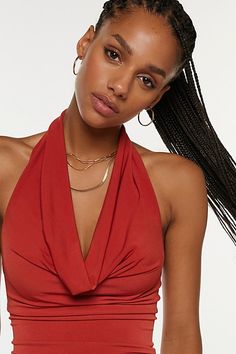 Sleek Silence + Noise top in a halter neckline style. Designed in a soft & stretchy knit featuring a plunging v-neckline with cowl draping and finished with an open back. Only at Urban Outfitters. Features Silence + Noise Coyote cowl neck top Cropped halter top Soft and stretchy knit Plunging v-neckline with halter strap Draping on the bust and v-hem bodice Open back Slim body-skimming fit Cropped length Easy pull-over style UO exclusive Content + Care 94% Polyester, 6% spandex Machine wash Impo Black Halter Top Outfit Jeans, V-neck Halter Top With Built-in Bra For Party, Party V-neck Halter Top With Built-in Bra, Seamless V-neck Crop Top For Party, Party Halter Top With Built-in Bra And V-neck, Seamless V-neck Party Tops, Solid Stretch V-neck Halter Top, Stretch Seamless V-neck Halter Top, Stretch Halter Neck Top For Date Night