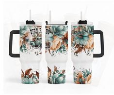 three travel mugs with floral designs on them