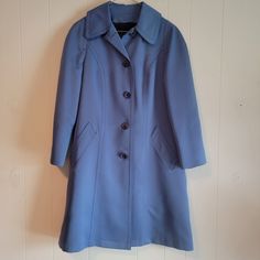 This is a vintage, London Fog, Maincoats, Imagitex, St Ives Cloth, women's, blue, wool and nylon lined, trench coat in a size 8 petite. The exterior is a textured polyester. The lining zips out. It it has a small discoloration and a flaw in the textile, as you can see in the images. All sales are final.  The measurements are as follow: (All measurements taken flat and from the exterior of the garment.): Sleeve Length from the armpit: 15 inches Armpit to Armpit: 19.5 inches Waist: 19 inches  Length From Back of the collar: 36.25 inches  If you have a wish list or are looking for something specific, please ask. I may have exactly what you are looking for.  As always please convo me with any questions or concerns regarding this item or with any international shipping questions. Unfortunately Blue Long Sleeve Pea Coat With Button Closure, Vintage Blue Outerwear With Pockets, Classic Blue Long-sleeved Wool Coat, Vintage Blue Outerwear With Button Closure, Vintage Navy Long-sleeve Outerwear, London Fog, Vintage London, St Ives, Blue Wool