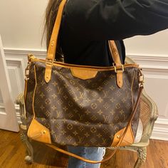 Authentic Louis Vuitton Louis Vuitton Retired Monogram Tote Crossbody Zippered Tote Bag Pre-Loved Retired Louis Vuitton Estrella Gm. Can Be Worn As A Crossbody, Satchel Or Shoulder Bag. Zip Top Closure. Includes Crossbody Strap. Scrape At Base And Lower Side As Pictured. Small Water Spot On Interior. Lv Gold Tone Zipper Pull. Includes Crossbody Strap. Certified Authentic Through Poshmark Authentication. Approximate Measurements: 14”L (At Base) X 12”H X 5”W 8" Drop Shoulder Strap 31" Crossbody St Lv Tote Bag, Lv Tote, Zippered Tote Bag, Crossbody Satchel, Monogram Tote, Zipper Tote Bag, Zippered Tote, Zip Top, Crossbody Strap