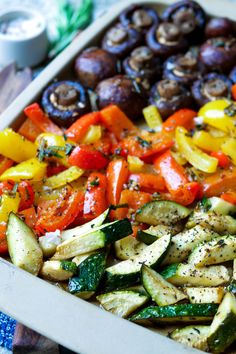 a tray filled with assorted vegetables on top of a table