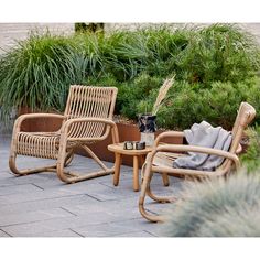 two chairs and a table on a patio