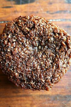 a close up of a cookie on a wooden table