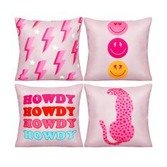 four pillows with different designs on them, one pink and the other red in various colors