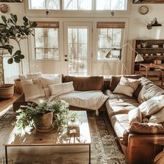 a living room filled with furniture and a fire place in front of a large window