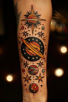 an arm tattoo with planets and stars on it