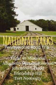 a train track with the words national parks on it and an image of a white building