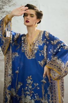 Blue silk kaftan with floral block print and bead embellished neckline. Paired with printed pant. - Aza Fashions Bohemian Silk Lawn Suit For Eid, Traditional Unstitched Kaftan With Printed Motifs, Bollywood Style Designer Kaftan With Printed Motifs, Bollywood Style Kaftan With Printed Motifs For Eid, Blue Silk Lawn Suit With Printed Motifs, Bollywood Style Festival Kaftan With Printed Motifs, Elegant Kaftan With Printed Motifs And Kimono Sleeves, Eid Georgette V-neck Kurta, Eid Bollywood Kaftan With Printed Motifs