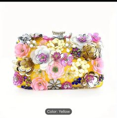 This is an Alexander McQueen Knuckle Clutch with an exterior made of acetate. The clutch features an elegant floral pattern with a vintage flower theme, perfect for women attending dinner parties. The exterior color is an eye-catching acid yellow, and the clutch is designed to be a decorator piece. Yellow Clutch, Flower Theme, Flowers Decor, Vintage Party, Elegant Flowers, Elegant Floral, Dinner Parties, Vintage Yellow, Exterior Colors