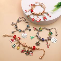 You can receive all the objects in the first main picture after you take a photo Wear your holiday spirit this winter with our Christmas Beaded Charm Bracelet Craft Kits! Each kit comes with a variety of beautifully colored beads and charms so you can create a piece of jewelry all your own. Perfect for use at school, over winter break, or with family and friends- no matter where you take this kit it is sure to bring a joyful experience. Children and adults alike enjoy these festive holiday bracelets! Quantity: 1 bracelet (each bracelet has a different style, choose according to your favorite charm) Color: Gold/Silver Uses: Christmas charm bracelet DIY random match Add a little creative fun to your Christmas romantic holiday, gifts for kids, friends, family and loved ones  Instructions  War Christmas Jewelry Diy, Antler Pendant, Holiday Bracelets, Beaded Charm Bracelet, Bracelet Craft, Bead Diy, Diy Charm, Cute Christmas Tree, Gift Bracelet