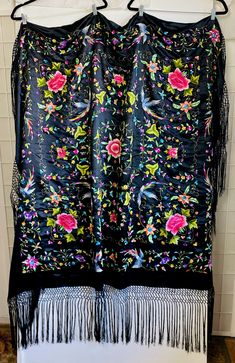 "Vintage Embroidered Black Silk Floral Fringe Shawl, 4'.4\" x 4'.7\" (not including fringe). Fringe; 11\" Good condition.  4'.4\" x 4'.7\" (not including fringe).   Fringe; 11\"" Black Shawl With Traditional Patterns For Festivals, Black Shawl With Intricate Embroidery In Traditional Drape, Black Embroidered Shawl With Traditional Drape, Black Embroidered Shawl For Festivals, Bohemian Black Shawl With Embroidered Border, Luxury Bohemian Shawl With Fringe, Traditional Black Embroidered Shawl, Black Bohemian Shawl With Embroidered Border, Luxury Bohemian Fringe Shawl