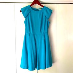 Bright, Turquoise Blue Dress. Flowy, Lightweight Fabric. Contoured Bust. Unique Looking Cap Sleeves. Sheer Center Back Panel. Exposed Back Zip. Pleated, Lined Skirt. New Without Tags. Measurements: Bust Armpit To Armpit: 33 Inches Waist: 26 Inches Length: 33 Inches Fyi For Those With Allergies, We Have Fur Babies (Cats And Dogs) At Home. Turquoise Blue Dress, Blue Sheers, Turquoise Blue, Fit And Flare Dress, Cap Sleeves, Fit And Flare, Blue Dresses, Mini Dress, Turquoise