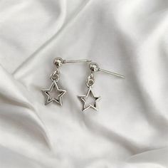 Enhance your look with these dainty star earrings, beautifully handcrafted in sterling silver. Featuring a delicate star design, these earrings bring a touch of celestial elegance to any outfit. Perfect for sensitive ears, they offer both comfort and a timeless charm. ● 4mm 925 sterling silver stud post  ● about 1.5cm alloy shooting star charm  💎Sterling Silver: Provides durability and a sleek, polished finish. 💎Handmade Craftsmanship: Each pair is meticulously crafted for unique quality. 💎Da Dainty Sterling Silver Earrings With Star Charm, Minimalist Star Earrings For Everyday, Elegant Silver Earrings With Star Charm, Minimalist Sterling Silver Star Charm Earrings, Silver Earrings With Star Charm For Everyday, Silver Star Charm Earrings For Everyday, Dainty Sterling Silver Star Earrings, Silver Star Charm Earrings, Minimalist Star Charm Earrings As Gift