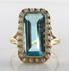 ad eBay - Presented here is a stunningly beautiful handmade Huge English 9K CT Gold Art Deco inspired near flawlessNatural Blue Topaz and24 Fresh Water Pearl Ring. This is a substantial ring full of Art Deco charm. Elegant Blue Pearl Ring With Gemstone, Blue Pearl Ring For Anniversary, Elegant Blue Pearl Ring, High Luster Blue Jewelry For Anniversary, Elegant Blue Pearl Ring For Formal Occasions, Elegant Blue Pearl Ring As Gift, Blue Gemstone Pearl Ring For Anniversary, Oval Blue High Luster Jewelry, Formal High Luster Blue Jewelry