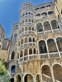 an old building with many balconies on it