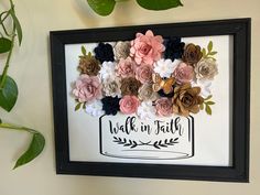 a wall hanging with flowers on it and the words walk in faith written below them