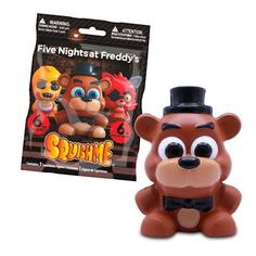 the five nights at teddy's squirme toy is next to its packaging