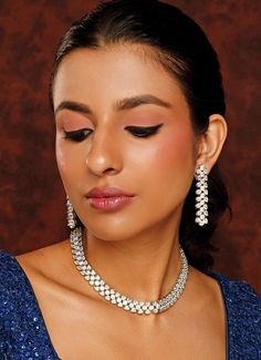 White Finish Faux Diamond Necklace Set Zevar By Geeta - Fabilicious Fashion Luxury White Fusion Style Bridal Necklace, Luxury White Necklace For Diwali, Luxury White Necklaces For Diwali, Luxury Bollywood White Bridal Necklace, Luxury Traditional Diamond Necklace, Luxury Diamond Necklace For Receptions, Luxury Necklaces With Matching Earrings For Reception, Luxury White Fusion Bridal Necklace, Traditional Luxury Diamond Necklace