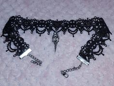 This gorgeous handmade black lace choker is absolutely stunning and has a gorgeous silver plated crow skull charm attached, giving off glam goth vibes for days 🖤 The lace part measures 12" and the choker as a whole measures 17" including clasp and extender chain... I can make the lace/ chain longer or shorter no problem, so if you need the measurements adjusting just let me know on the order and I can make it to fit your measurements 🖤 Handmade Punk Black Choker, Handmade Black Punk Choker, Halloween Witchy Black Choker, Gothic Choker For Halloween And Alternative Fashion, Emo Choker For Halloween Party, Witchy Black Choker For Gift, Emo Halloween Party Choker, Handmade Black Choker For Halloween, Handmade Adjustable Choker For Alternative Fashion