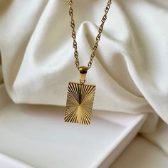 TIMELESS- This exquisite 18k gold necklace is the epitome of sophisticated style and minimalism. Delicately crafted by hand, the dainty chain and timeless design make it a truly timeless piece.  It's waterproof, anti tarnish, and adjustable, making it perfect for everyday wear. The perfect accessory to elevate any look.  ☆Waterproof  ☆Hypoallergenic ☆Anti tarnish ☆40cm + 5cm extension for extra comfort and styling ✨ABOUT CRESCENT JEWELRY DESIGNS All jewelry is made by Crescent Jewelry Designs in the heart of Nashville Tennessee. Designing unique and beautiful jewelry is our passion, and our goal is to make sure you are 100% satisfied with the products. Each piece is made with hypoallergenic earring posts and free from lead and nickel. If you have any questions or concerns regarding the pro Gold Rectangular Necklaces As Gift For Her, Rectangular Gold Necklace Gift For Her, Dainty Everyday Necklace With Rectangular Pendant, Gold Square Pendant Necklace As Gift For Her, Gold Charm Necklace With Square Pendant, Gold Charm Necklaces With Clavicle Chain And Square Pendant, 14k Gold-filled Rectangular Pendant Jewelry, Gold Rectangular 14k Gold Filled Necklace, Gold Necklace With Rectangular Pendant Clavicle Chain