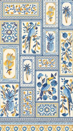 blue and yellow tiles with birds, flowers and pineapples in the center on a white background