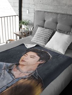 there is a bed with a photo on it