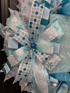 a blue and white wreath with snowflakes on it