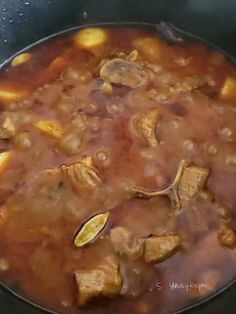 the food is being cooked in the pot on the stove top and ready to be eaten